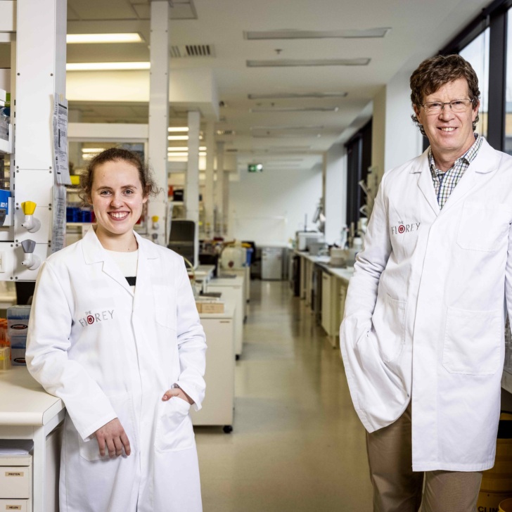 Researchers Professor Chris Reid and PhD student Lauren Bleakly, and Ebony the Mouse. Picture- Nicole Cleary