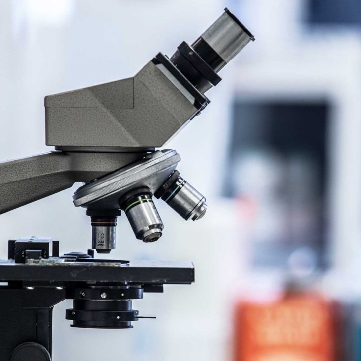 Microscope in laboratory with blurred background