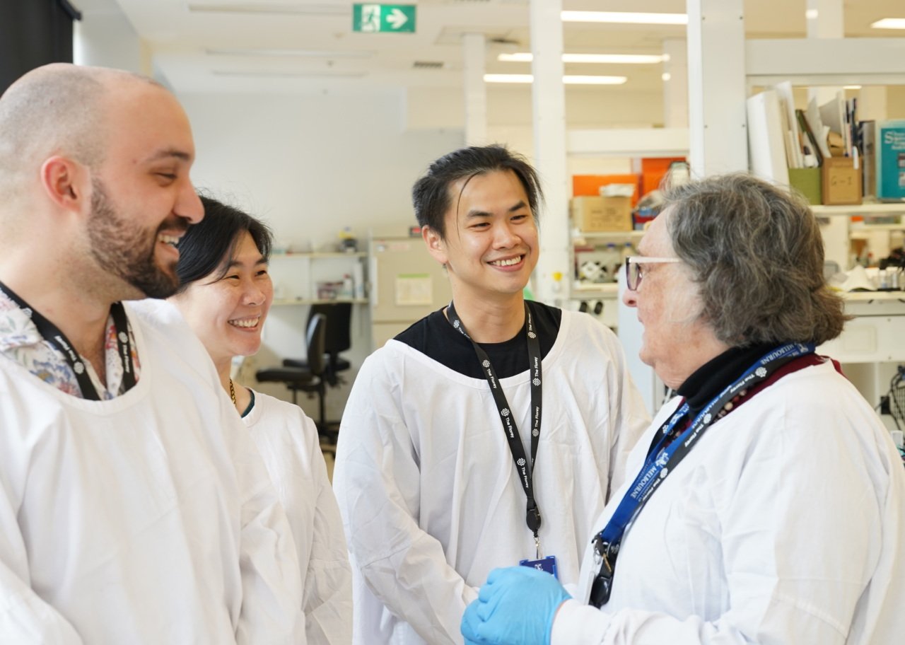 Phd students in white lab coats 