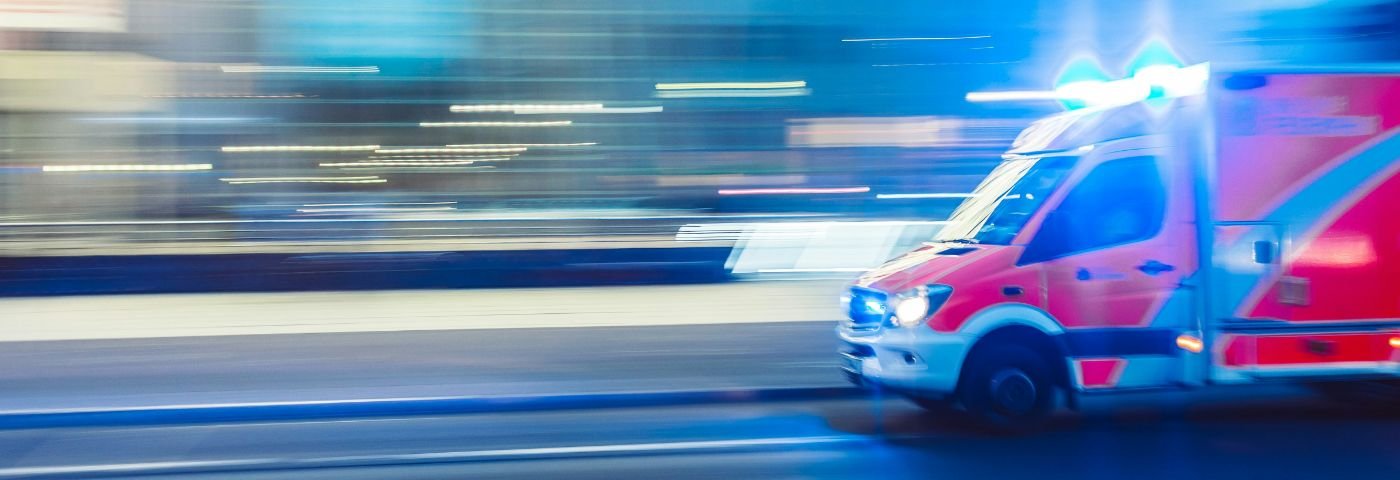 Ambulance speeds along city street