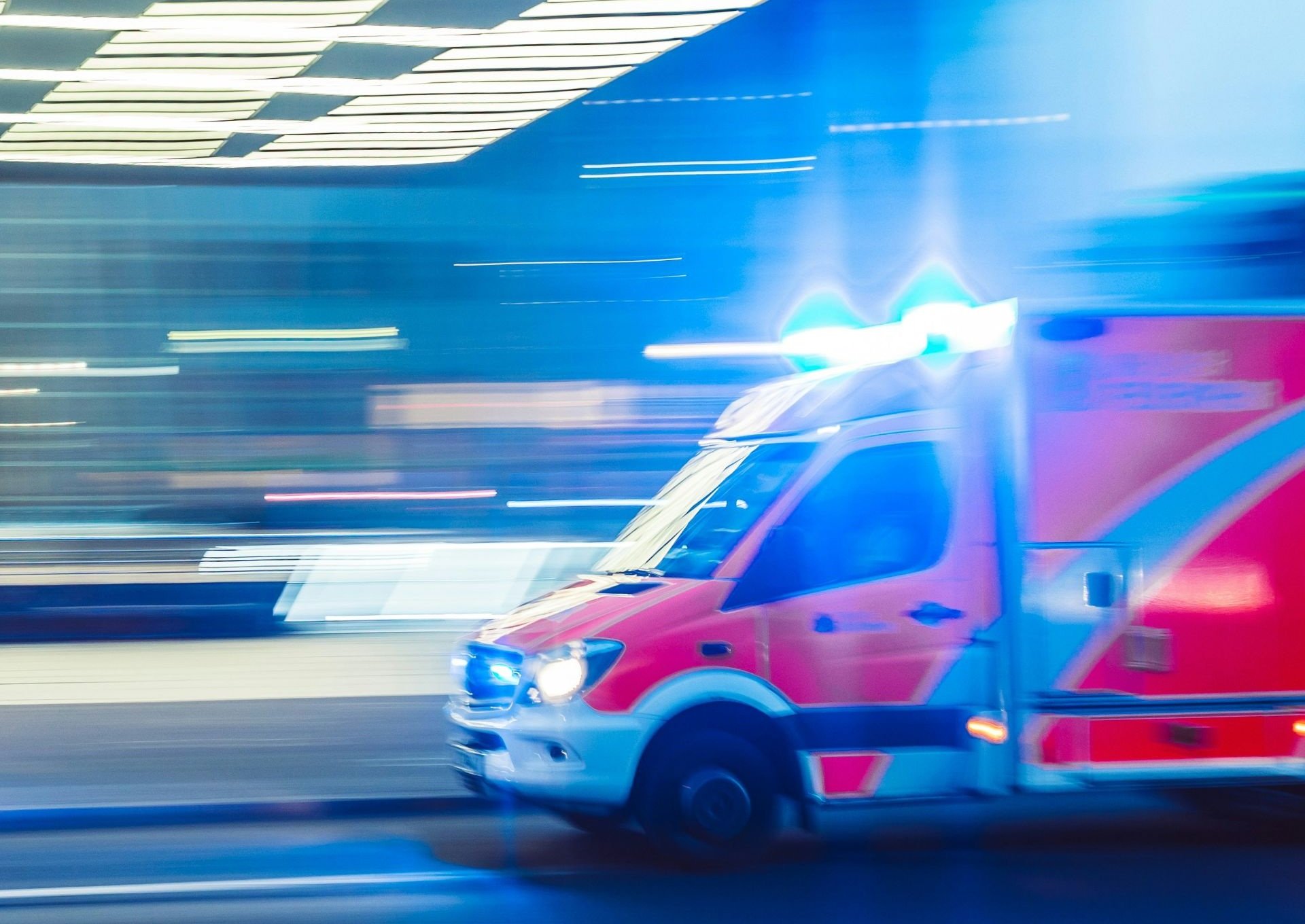 Ambulance speeding along city street