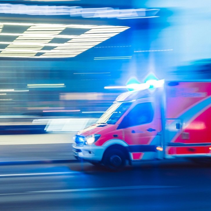 Ambulance speeding along city street
